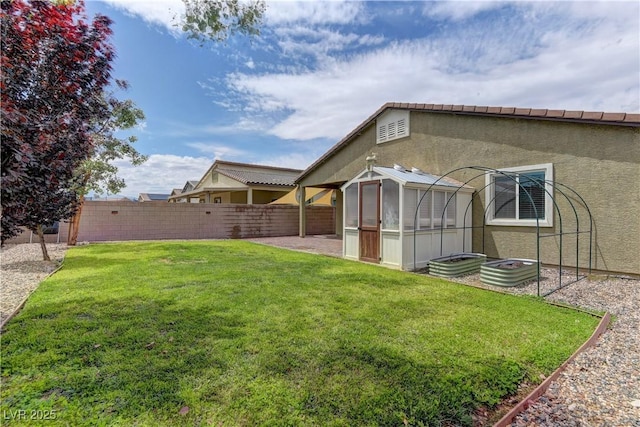 4441 Glossier Ave, North Las Vegas, NV 89084 - fenced backyard featuring a sunroom