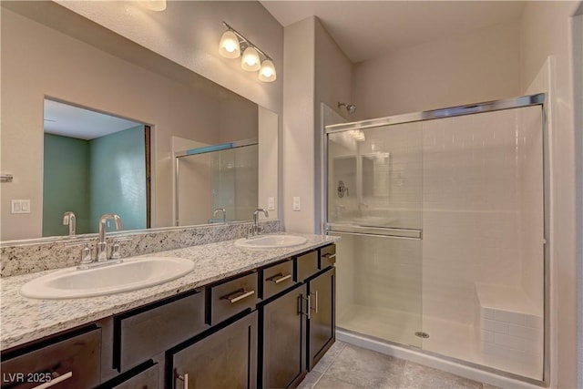 4441 Glossier Ave, North Las Vegas, NV 89084 - full bathroom featuring a shower stall, double vanity, and tile patterned flooring