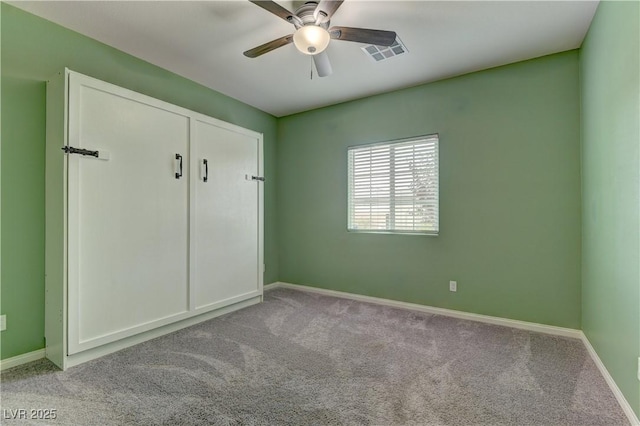 4441 Glossier Ave, North Las Vegas, NV 89084 - unfurnished bedroom with carpet and a ceiling fan