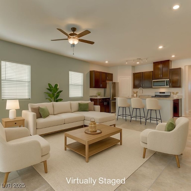 4441 Glossier Ave, North Las Vegas, NV 89084 - living area with ceiling fan, recessed lighting, and light tile patterned floors