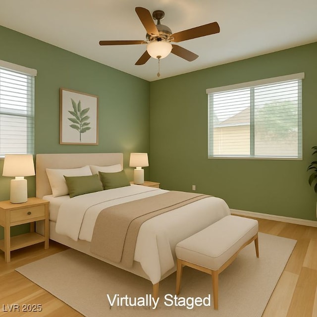 4441 Glossier Ave, North Las Vegas, NV 89084 - bedroom featuring light wood-style floors and a ceiling fan