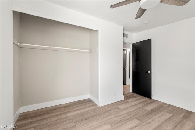 1915 Balboa Ave, Las Vegas, NV 89169 - unfurnished bedroom featuring wood finished floors, a ceiling fan, and a closet