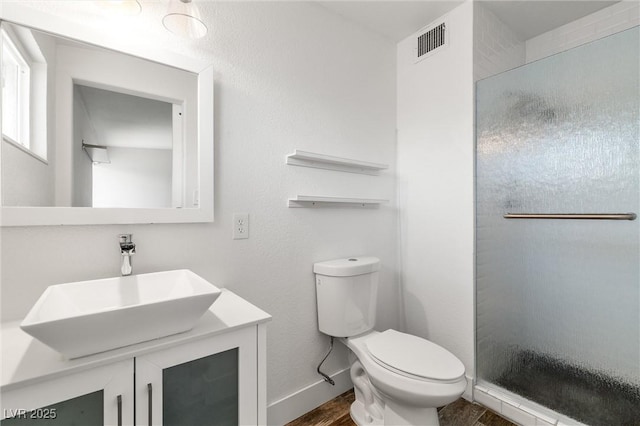 1915 Balboa Ave, Las Vegas, NV 89169 - full bathroom with wood finished floors, a stall shower, and vanity