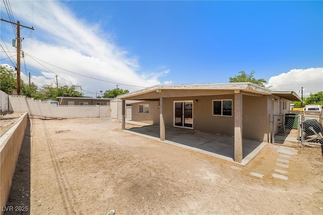 1915 Balboa Ave, Las Vegas, NV 89169 - back of house featuring a fenced backyard, stucco siding, a patio, and a gate