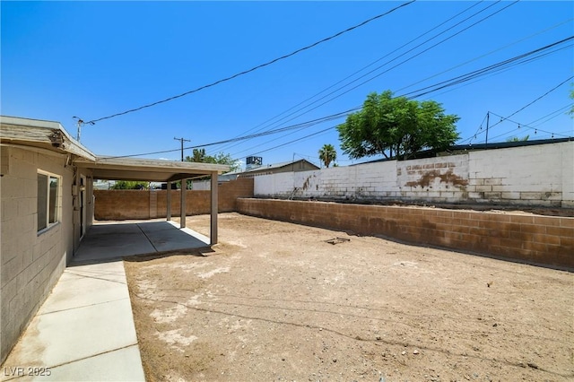1915 Balboa Ave, Las Vegas, NV 89169 - fenced backyard with a patio area