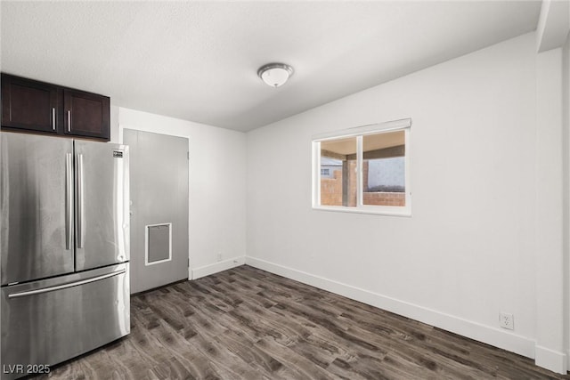 1915 Balboa Ave, Las Vegas, NV 89169 - kitchen featuring freestanding refrigerator, dark wood finished floors, and dark brown cabinetry