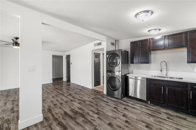 1915 Balboa Ave, Las Vegas, NV 89169 - laundry room featuring estacked washer and dryer, dark wood-style flooring, and ceiling fan