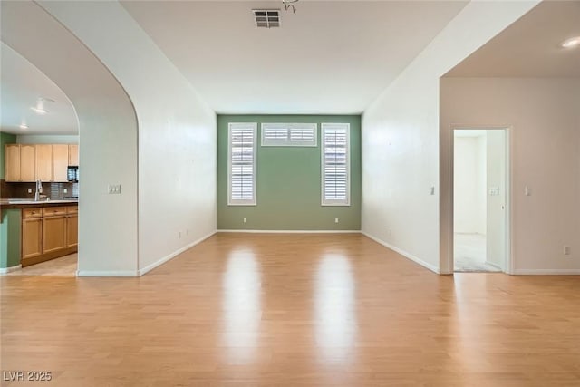 262 Pebble Canyon Dr, Las Vegas, NV 89123 - unfurnished room featuring light wood-style flooring and arched walkways