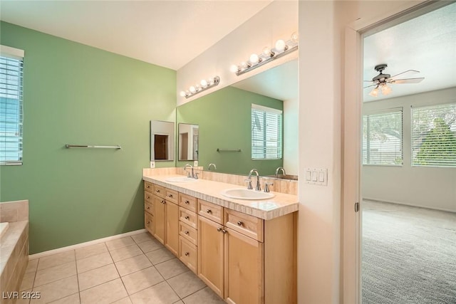 262 Pebble Canyon Dr, Las Vegas, NV 89123 - full bathroom with double vanity, plenty of natural light, tiled bath, and ceiling fan