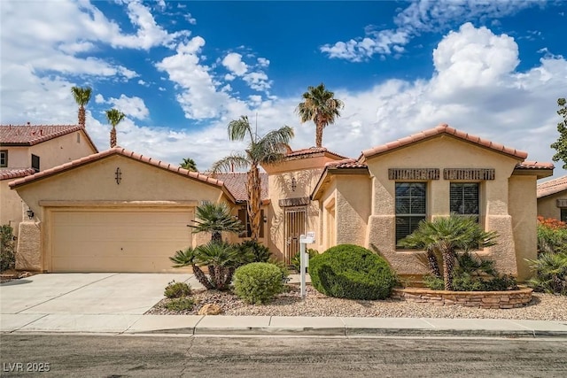 262 Pebble Canyon Dr, Las Vegas, NV 89123 - mediterranean / spanish-style house featuring a garage, concrete driveway, stucco siding, and a tiled roof
