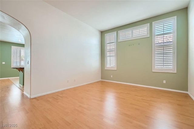 262 Pebble Canyon Dr, Las Vegas, NV 89123 - unfurnished room with arched walkways and light wood finished floors