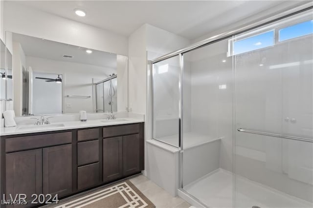 10106 Queens Pearl St, Las Vegas, NV 89141 - bathroom with double vanity, a stall shower, and tile patterned flooring