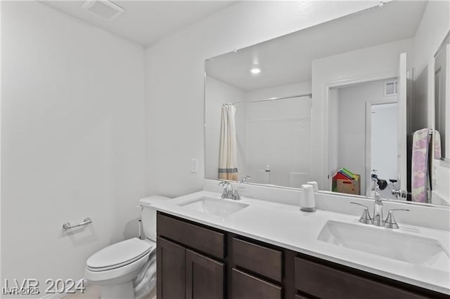 10106 Queens Pearl St, Las Vegas, NV 89141 - bathroom featuring double vanity and a shower with shower curtain