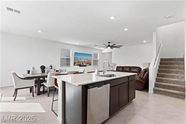 10106 Queens Pearl St, Las Vegas, NV 89141 - kitchen featuring stainless steel dishwasher, open floor plan, light countertops, a center island with sink, and recessed lighting
