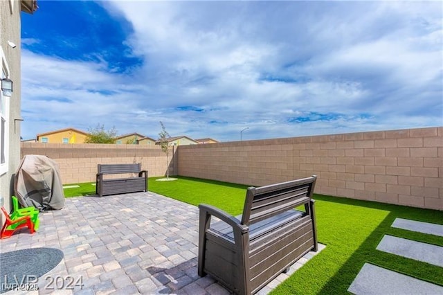 10106 Queens Pearl St, Las Vegas, NV 89141 - fenced backyard with a grill and a patio