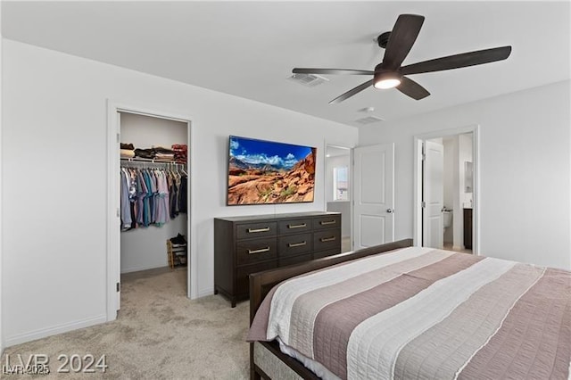 10106 Queens Pearl St, Las Vegas, NV 89141 - bedroom featuring a walk in closet, light colored carpet, a closet, ceiling fan, and ensuite bathroom
