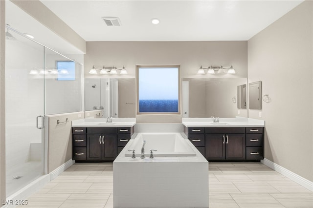 5676 Corona Vista St, Las Vegas, NV 89135 - bathroom featuring two vanities, a stall shower, and a bath