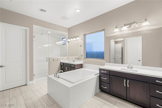 5676 Corona Vista St, Las Vegas, NV 89135 - bathroom with a shower stall, a garden tub, and two vanities