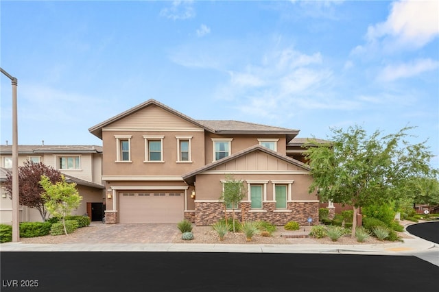 5676 Corona Vista St, Las Vegas, NV 89135 - view of front of home with stone siding, stucco siding, and driveway