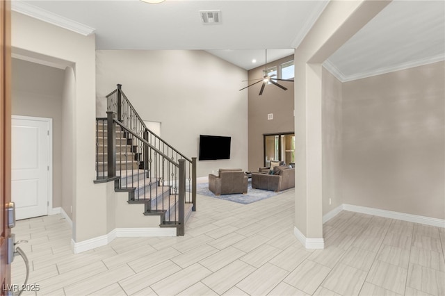 5676 Corona Vista St, Las Vegas, NV 89135 - entrance foyer featuring a ceiling fan, stairway, crown molding, and a towering ceiling
