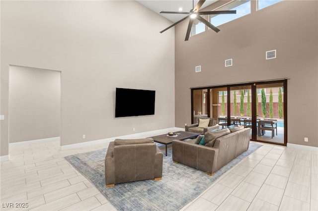 5676 Corona Vista St, Las Vegas, NV 89135 - living area with ceiling fan, a towering ceiling, and healthy amount of natural light