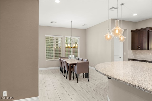 5676 Corona Vista St, Las Vegas, NV 89135 - dining space with a chandelier and recessed lighting