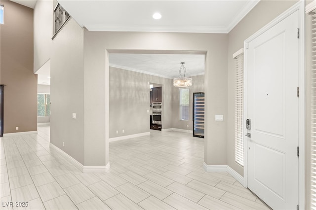 5676 Corona Vista St, Las Vegas, NV 89135 - entryway featuring a chandelier, ornamental molding, wine cooler, and recessed lighting