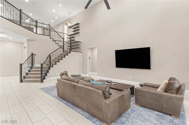 5676 Corona Vista St, Las Vegas, NV 89135 - living area featuring stairway, a towering ceiling, and recessed lighting