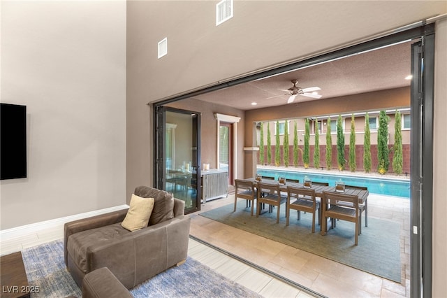 5676 Corona Vista St, Las Vegas, NV 89135 - dining room with a ceiling fan and baseboards