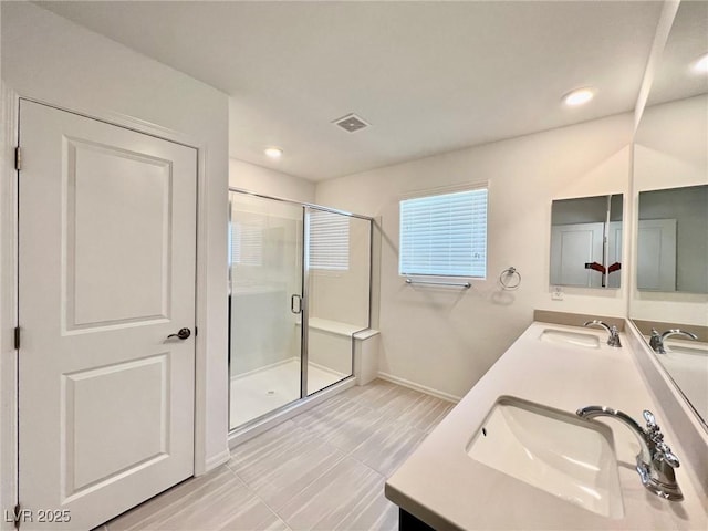 8003 Adelaide Hills St, Las Vegas, NV 89113 - bathroom with double vanity, a stall shower, and recessed lighting
