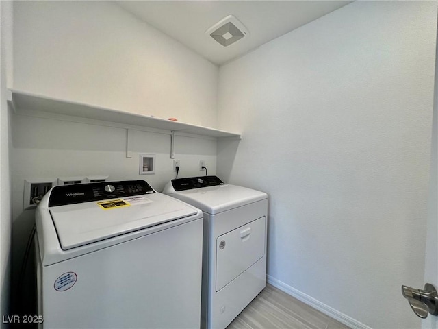 8003 Adelaide Hills St, Las Vegas, NV 89113 - laundry room with washer and clothes dryer and baseboards