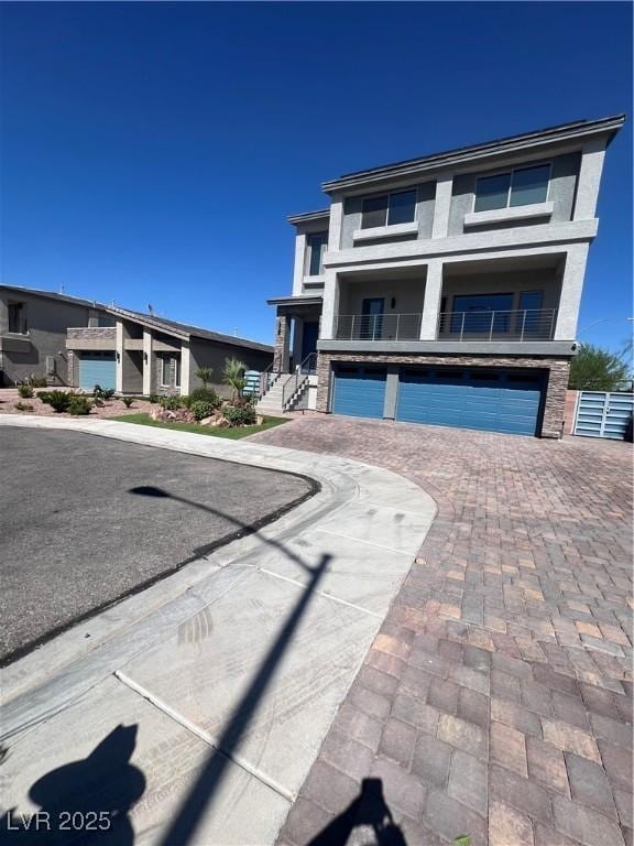 8094 Noble Ridge St, Las Vegas, NV 89139 - view of front of home with an attached garage and decorative driveway