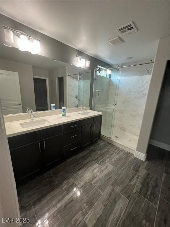 8094 Noble Ridge St, Las Vegas, NV 89139 - full bathroom with a shower stall, double vanity, and wood finish floors