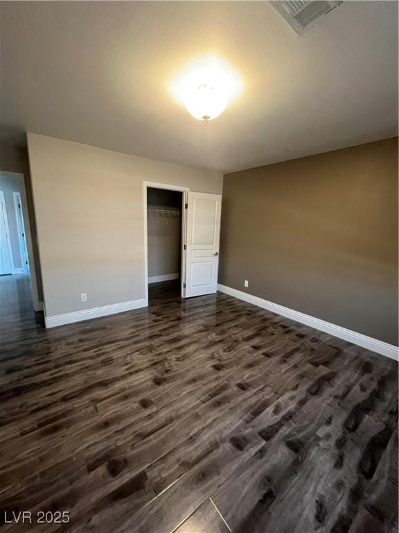 8094 Noble Ridge St, Las Vegas, NV 89139 - unfurnished bedroom with dark wood-type flooring and a closet