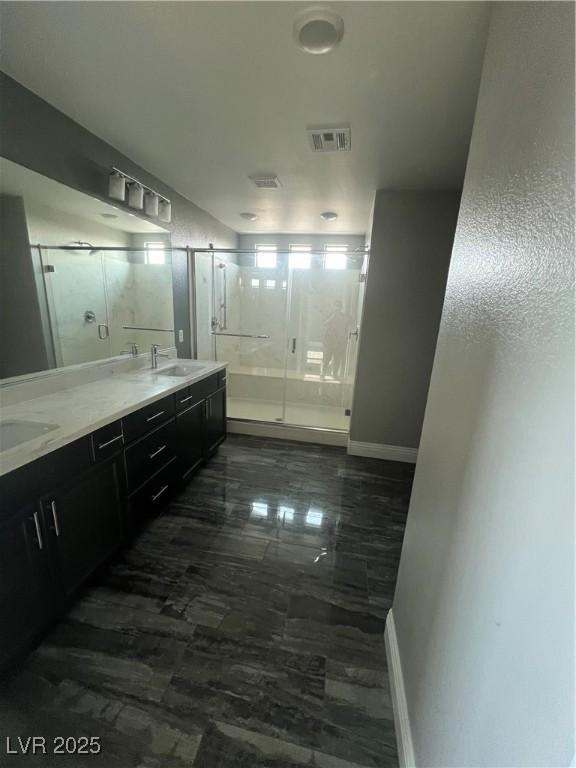 8094 Noble Ridge St, Las Vegas, NV 89139 - full bath with a shower stall, double vanity, and marble finish floors