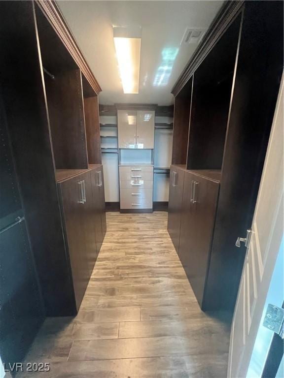 8094 Noble Ridge St, Las Vegas, NV 89139 - walk in closet featuring light wood-style floors