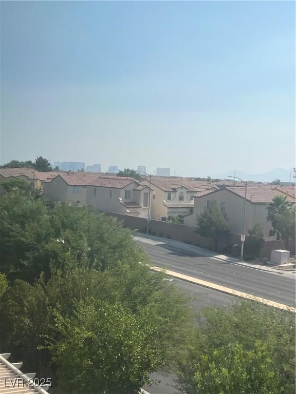 8094 Noble Ridge St, Las Vegas, NV 89139 - view of asphalt street with a residential view