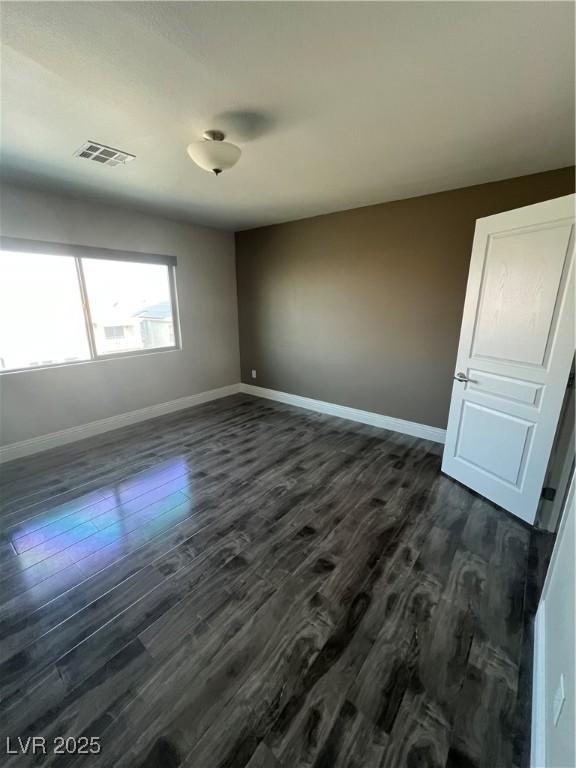 8094 Noble Ridge St, Las Vegas, NV 89139 - spare room with dark wood-style flooring