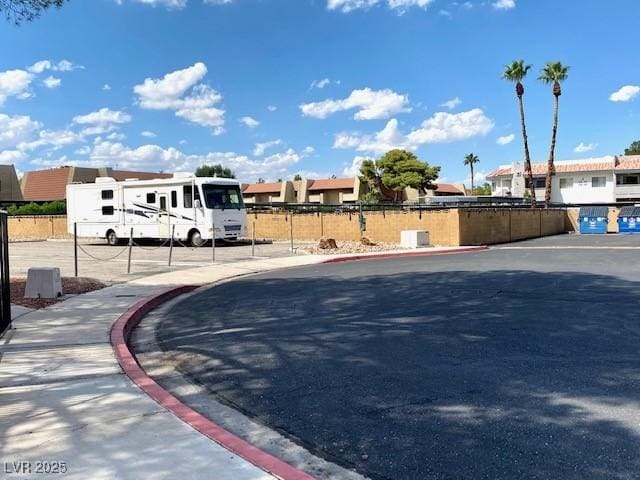 4242 Mississippi Ave, Las Vegas, NV 89103 - view of asphalt road featuring curbs, sidewalks, and a residential view
