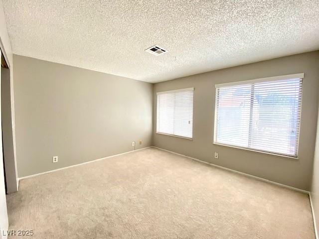 4242 Mississippi Ave, Las Vegas, NV 89103 - unfurnished room with carpet flooring and a textured ceiling