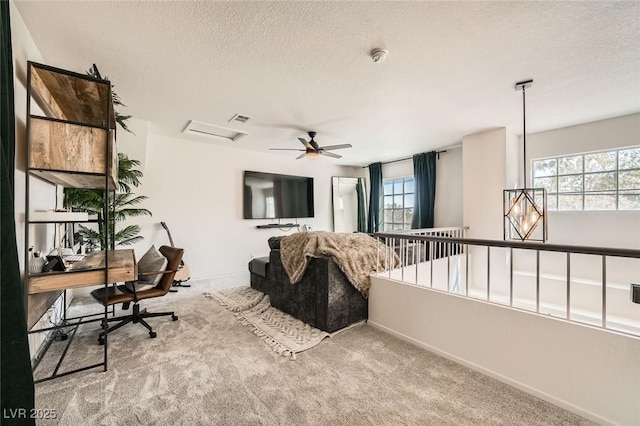 2133 Desert Pines St, Las Vegas, NV 89134 - carpeted living room with a textured ceiling, a desk, healthy amount of natural light, and ceiling fan