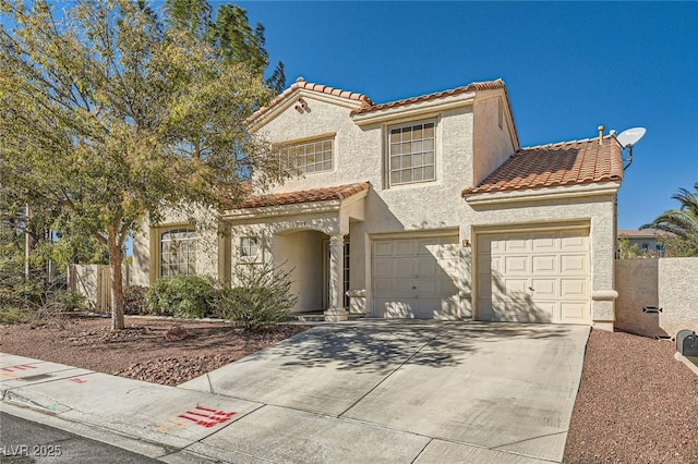 2133 Desert Pines St, Las Vegas, NV 89134 - mediterranean / spanish-style house with a tiled roof, concrete driveway, stucco siding, and an attached garage