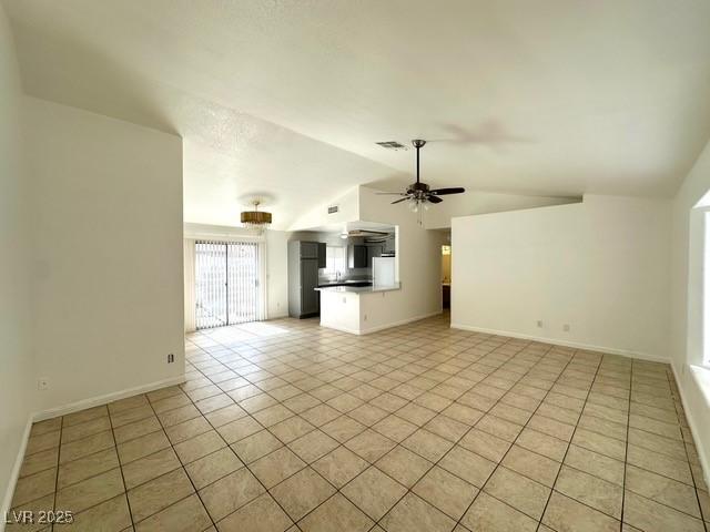 5400 Maddox Ave, Las Vegas, NV 89107 - unfurnished living room with lofted ceiling, a ceiling fan, and light tile patterned floors
