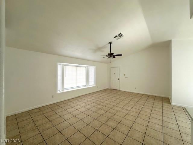 5400 Maddox Ave, Las Vegas, NV 89107 - empty room featuring light tile patterned floors, lofted ceiling, and ceiling fan