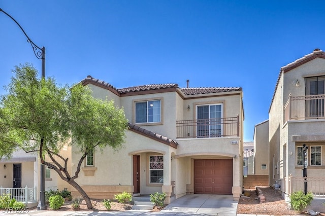 9065 Tantalizing Ave, Las Vegas, NV 89149 - mediterranean / spanish-style house featuring a tiled roof, a balcony, stucco siding, a garage, and driveway