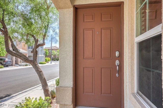 9065 Tantalizing Ave, Las Vegas, NV 89149 - property entrance featuring stucco siding