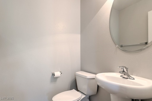 9065 Tantalizing Ave, Las Vegas, NV 89149 - half bathroom with toilet and a sink
