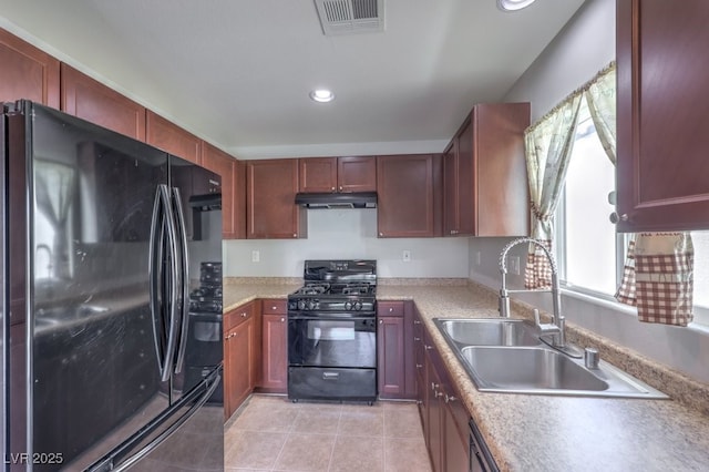 9065 Tantalizing Ave, Las Vegas, NV 89149 - kitchen featuring black appliances, under cabinet range hood, light countertops, recessed lighting, and light tile patterned flooring