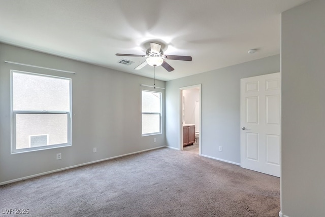 9065 Tantalizing Ave, Las Vegas, NV 89149 - unfurnished bedroom featuring carpet floors, ensuite bath, and ceiling fan