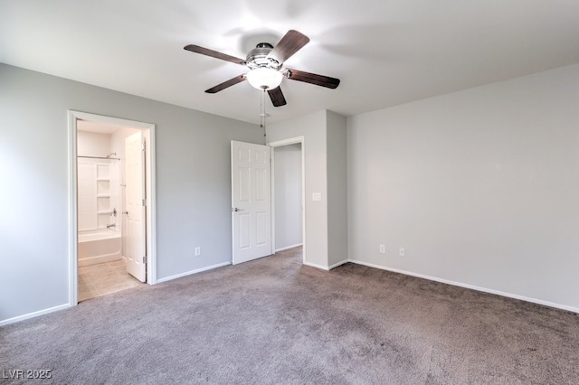 9065 Tantalizing Ave, Las Vegas, NV 89149 - unfurnished bedroom with carpet, a ceiling fan, and connected bathroom
